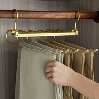 Perchero para pantalones dorado y ahorrador de espacio Regal